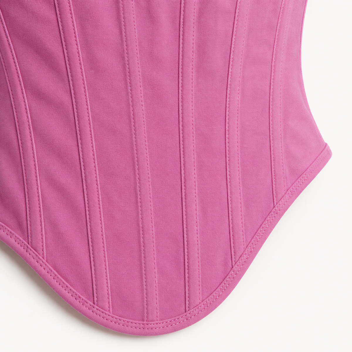 Top tipo corset rosado detalle de costuras